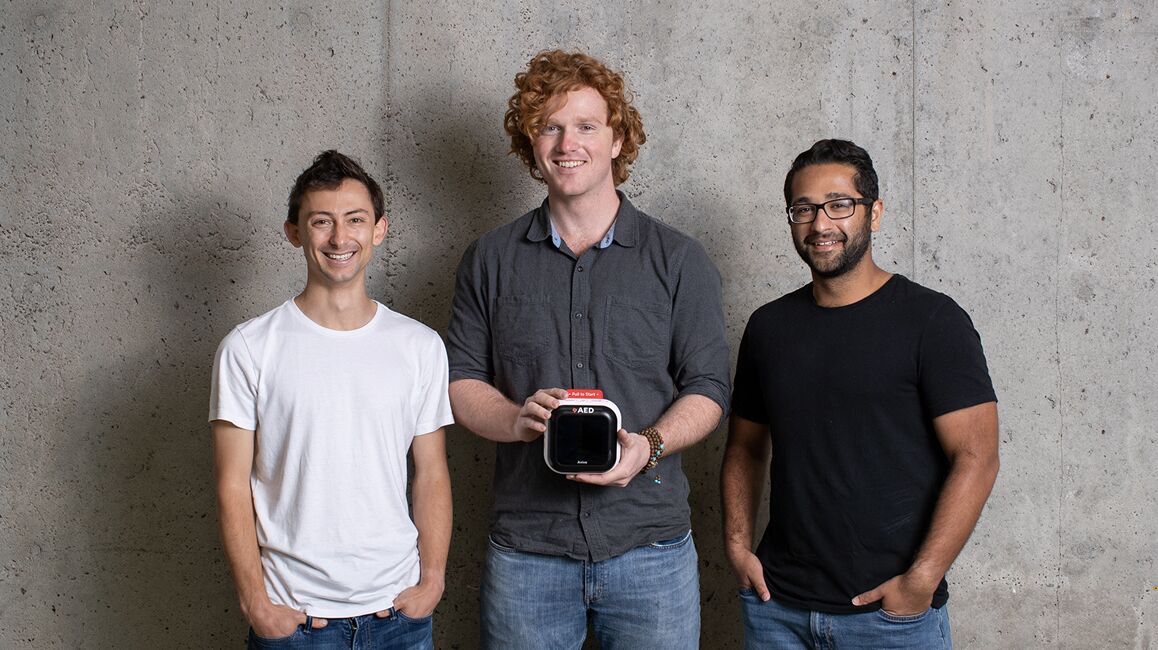 Avive AED founders holding an aed unit